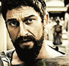 Bearded Man Looking at Camera With Crowd