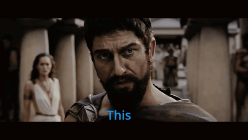 Bearded Man Looking at Camera With This in Blue