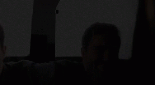 Bearded Man Looking in Mirror