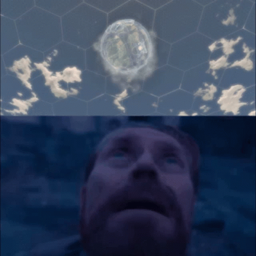 Bearded Man Looking Up at Sphere in Sky