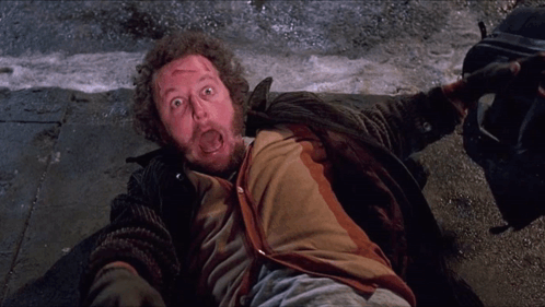 Bearded Man Lying On Ground Mouth Open GIF
