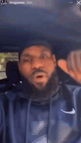 Bearded Man Making Funny Face in Back Seat