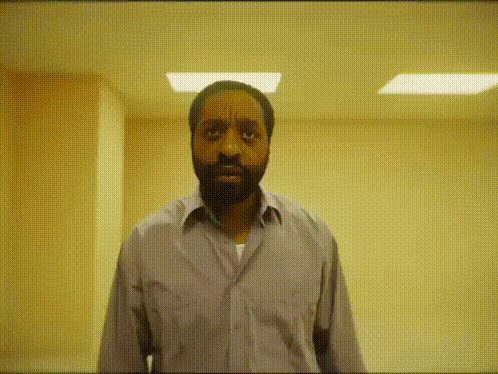 Bearded Man Making Funny Face in Hallway