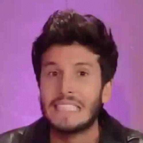 Bearded Man Making Funny Face in Leather Jacket