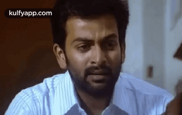 Bearded Man Making Funny Face in White Shirt