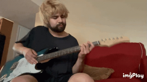 Bearded Man Playing Electric Guitar