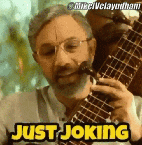 Bearded Man Playing Guitar Saying Just Joking