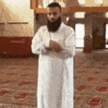 Bearded Man Praying in Mosque with Hands Folded
