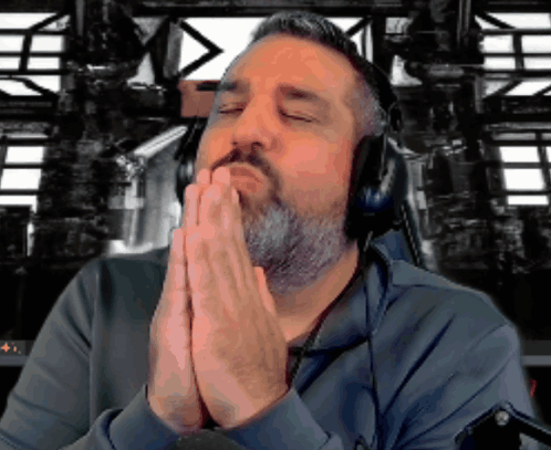 Bearded Man Praying with Headphones