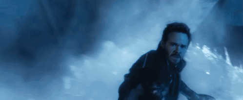 Bearded Man Running in Dark Room