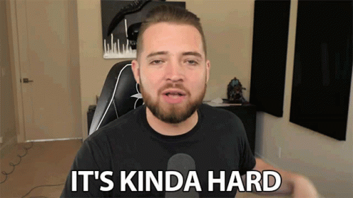 Bearded Man Saying It's Kinda Hard at Microphone