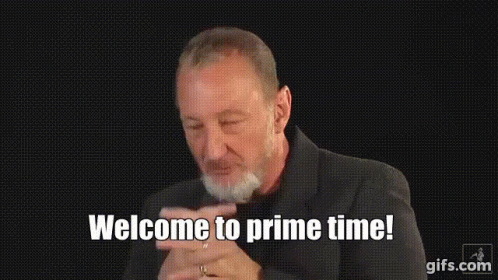 Bearded Man Saying Welcome to Prime Time