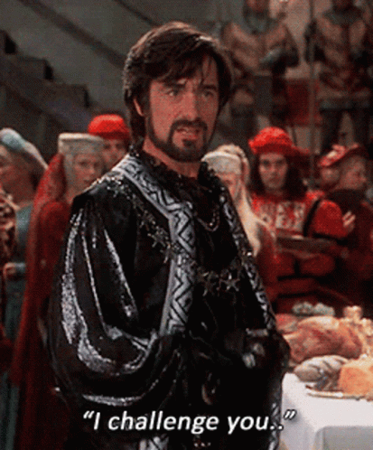 Bearded Man Says I Challenge You at Food Table