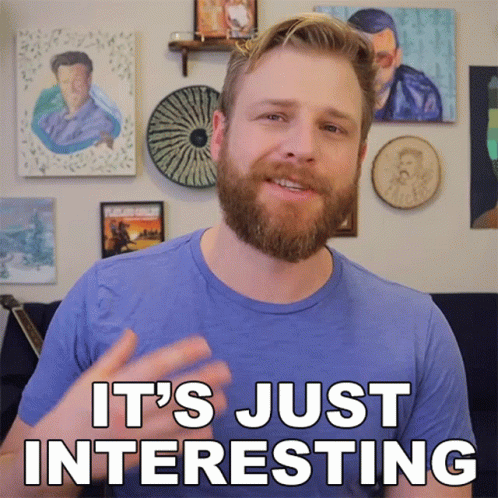 Bearded Man Says It's Just Interesting in Front of Paintings
