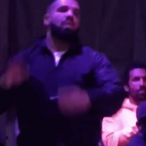 Bearded Man Singing In Dark Room GIF