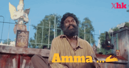 Bearded Man Sitting at Fence Saying Amma