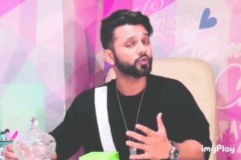 Bearded Man Sitting In Front Of Pink Wall Imgplay GIF