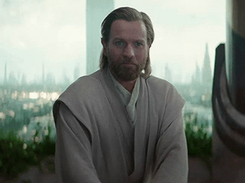 Bearded Man Sitting in Front of Window