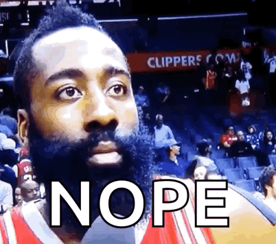 Bearded Man Sitting in Stands Saying Nope