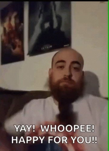 Bearded Man Sitting on Couch Says Yay Whoopee Happy For You