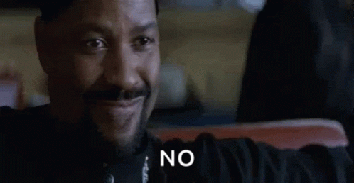 Bearded Man Sitting Smiling Saying No GIF
