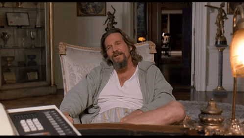 Bearded Man Sitting with Calculator