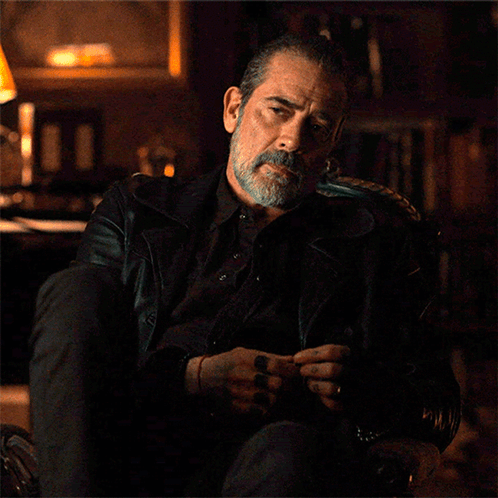 Bearded Man Sitting With Folded Hands GIF