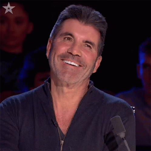 Bearded Man Smiling at Microphone with Star
