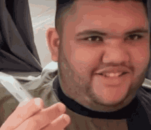 Bearded Man Smiling Holding Cigarette GIF