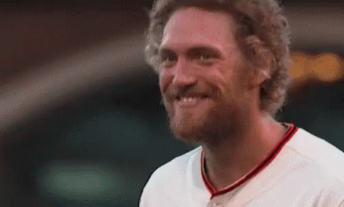 Bearded Man Smiling in Baseball Uniform