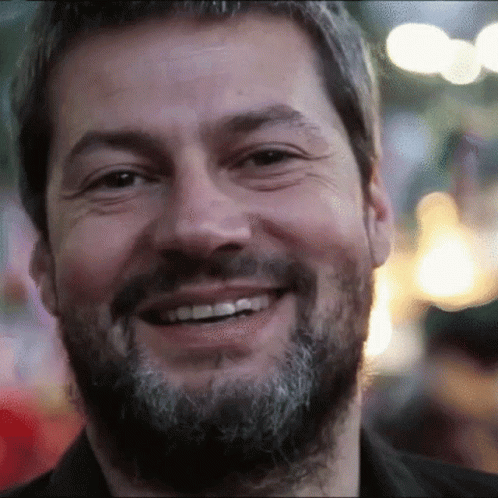 Bearded Man Smiling In Blurry Photo GIF