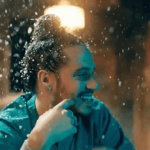 Bearded Man Smiling In Falling Snow GIF