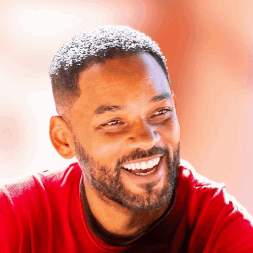 Bearded Man Smiling in Red Shirt