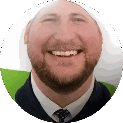Bearded Man Smiling in Suit and Tie