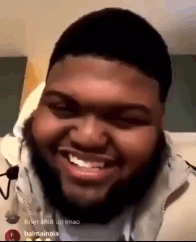 Bearded Man Smiling On Bed GIF