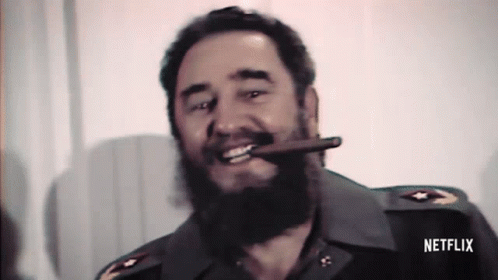 Bearded Man Smiling Smoking Cigar