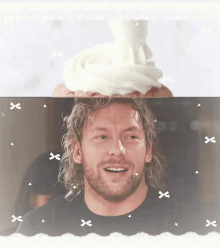 Bearded Man Smiling With Cupcake on Head