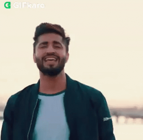 Bearded Man Smiling With Eyes Closed In Jacket GIF