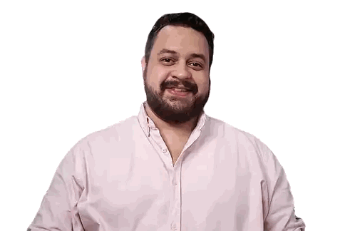 Bearded Man Smiling With Hands on Chest
