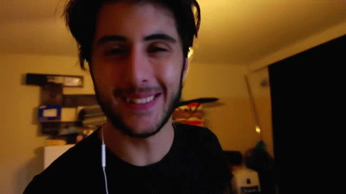 Bearded Man Smiling with Headphones