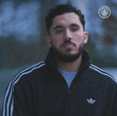 Bearded Man Smoking With Manchester City Logo