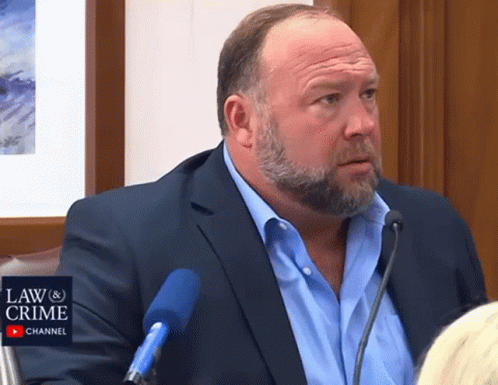 Bearded Man Speaking Into Microphone Law & Crime Logo