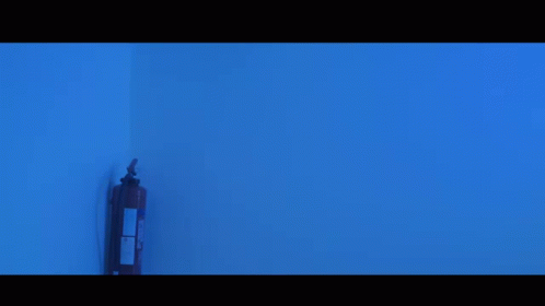 Bearded Man Standing in Blue Light