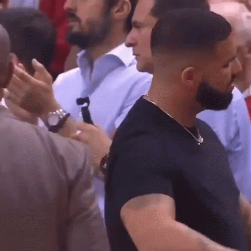 Bearded Man Standing in Crowd