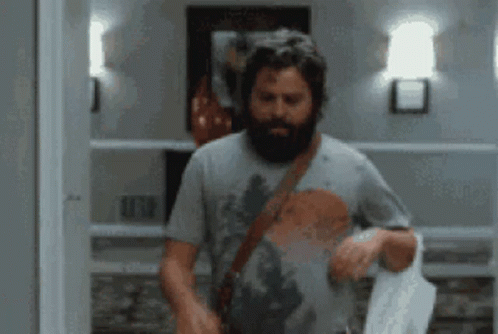 Bearded Man Standing In Room GIF