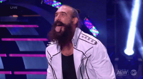 Bearded Man Standing On Stage With AEW Logo GIF