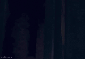 Bearded Man Statue Holding Red Lightsaber
