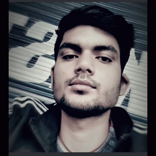 Bearded Man Taking Selfie With Sign Saying A