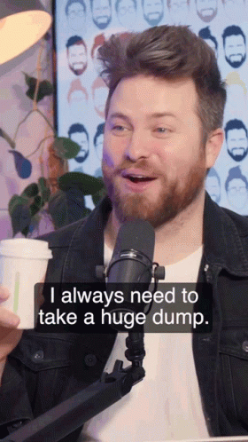 Bearded Man Talking Into Microphone Saying I Always Need to Take a Huge Dump