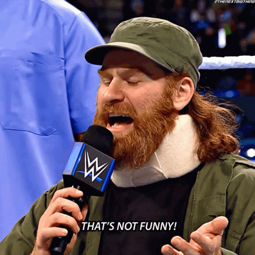 Bearded Man Talking into WWE Microphone